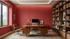 Vue d'ensemble d'une chambre à coucher bohème chic dont le mur principal est habillé de Papier Peint Rouge Terrecotta Texturé, créant une atmosphère chaleureuse et enveloppante