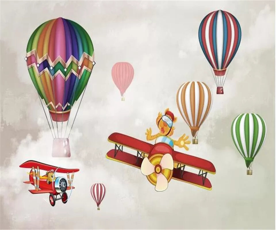 Papier peint enfant avions et montgolfières colorées