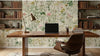 Détail texturé du papier peint vert pastel Alexa mettant en valeur des bouquets de fleurs sauvages délicatement illustrées dans un style botanique raffiné