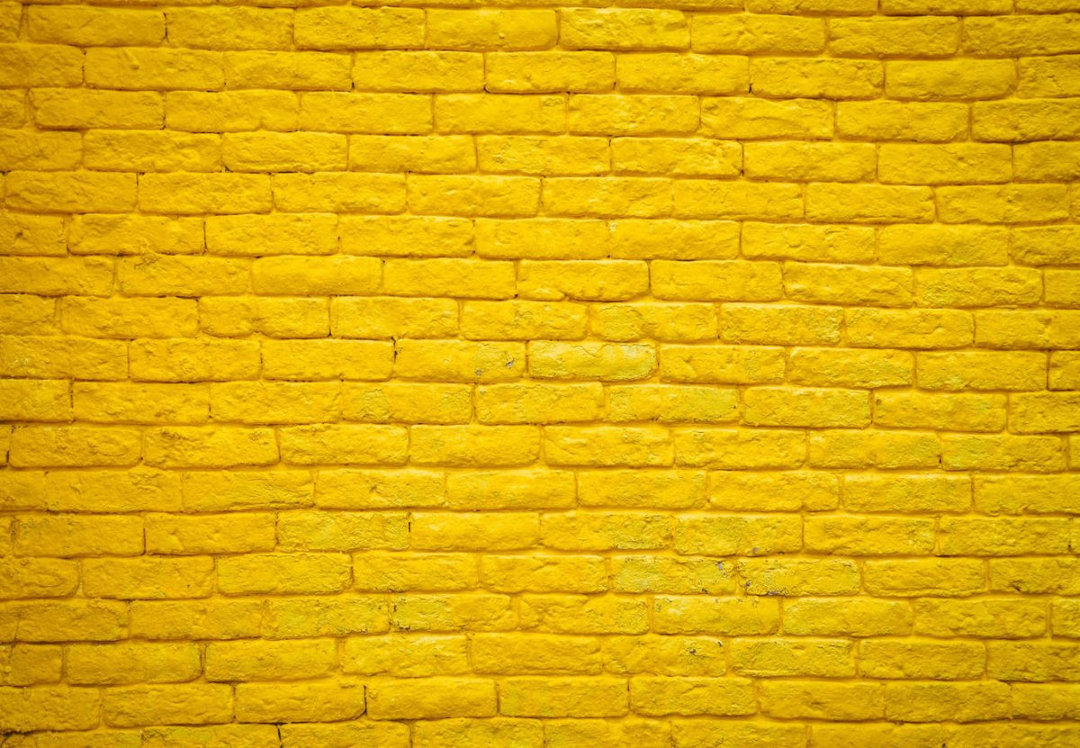 Papier peint brique jaune