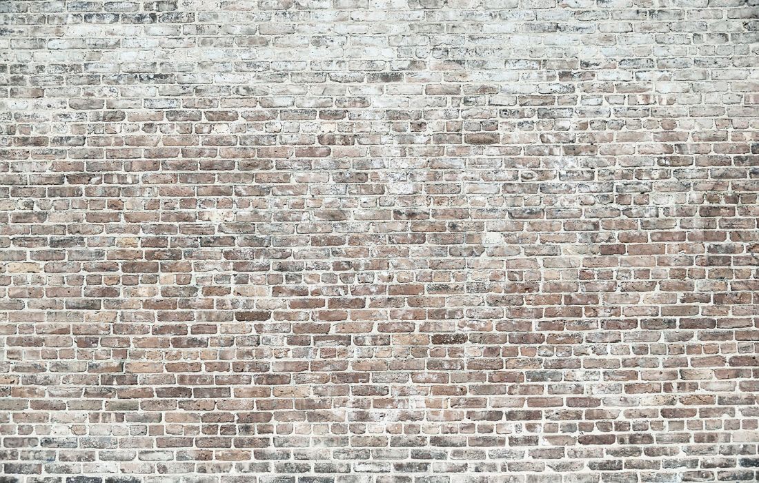 Papier peint couloir brique : briques grises et beige patinées aux joints clairs