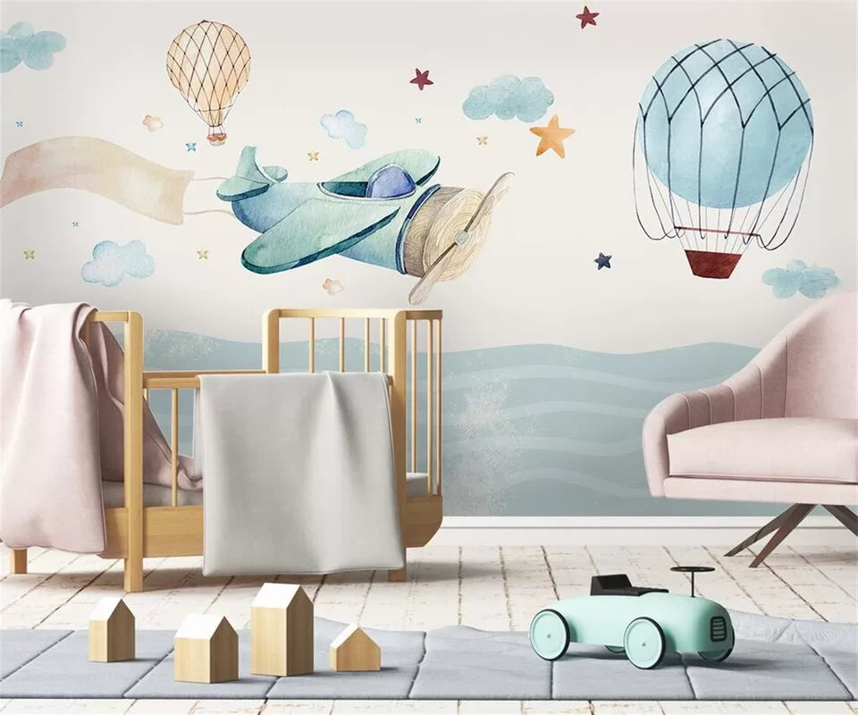 Child&#39;s wallpaper with airplanes and hot air balloons over the ocean