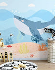 Child's wallpaper with a blue whale in the ocean